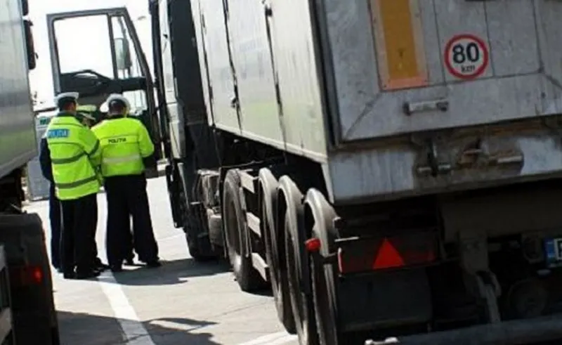 Șoferi de TIR sancționați de polițiști! Unul era beat, altul păcălea tahograful