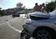 Motociclistul grăbit s-a lovit de-o remorcă și a urcat pe o mașină! Două persoane rănite!